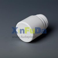 double cap of small plastic medicine bottle