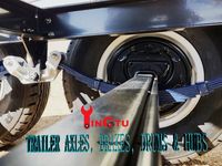 Trailer tandem axles with electric drum brakes